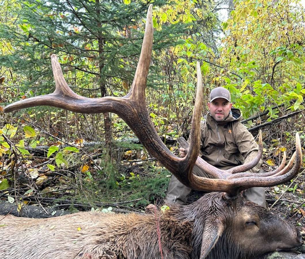 Successful hunter with a trophy elk.